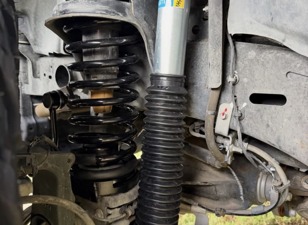 Upgraded front coil spring and Bilstein shock on the Gladiator.