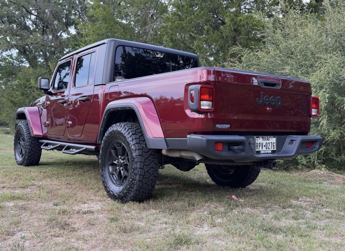 Rear three-quarter view of the Gladiator with tires tucked beneath the fender flares.