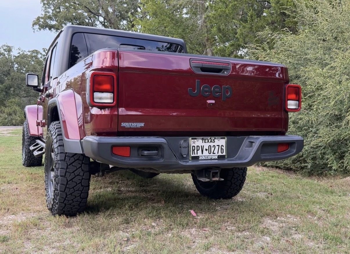 Rear view of the Gladiator showing the tailgate and tire fitment.