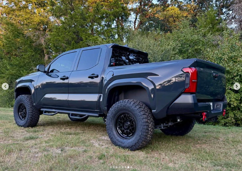 Rear three-quarter view of the lifted Tacoma